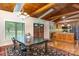 Formal dining area featuring a dark wood table, chandelier lighting, and convenient access to the kitchen at 182 Meek Rd, Gastonia, NC 28056
