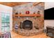 Beautiful stone fireplace with a decorative mantel, adding warmth and character to the living space at 182 Meek Rd, Gastonia, NC 28056