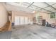 Spacious garage featuring a ramp to the house, multiple storage solutions, and a well-lit interior at 182 Meek Rd, Gastonia, NC 28056