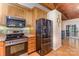 Kitchen featuring stainless steel appliances, built-in microwave, and sliding door access to an outside patio at 182 Meek Rd, Gastonia, NC 28056