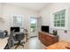 Functional home office with a well-lit workspace, computer setup, and convenient access to the outdoors, providing a great view at 182 Meek Rd, Gastonia, NC 28056