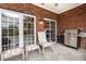 Relaxing outdoor patio with a grill and chairs, ideal for entertaining and enjoying the fresh air at 182 Meek Rd, Gastonia, NC 28056