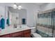 Bright bathroom features a vanity, a shower, and colorful accents at 1948 Winpole Ln, Charlotte, NC 28273