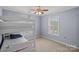 Bedroom with bunk beds, neutral carpet, and a bright window at 1948 Winpole Ln, Charlotte, NC 28273