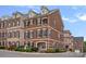 Attractive brick townhome with black shutters and manicured landscaping at 1948 Winpole Ln, Charlotte, NC 28273