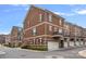 Brick townhome featuring garage and second floor balcony at 1948 Winpole Ln, Charlotte, NC 28273