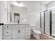 Modern bathroom featuring dual vanity and tiled walk-in shower with glass door at 2028 Cedar Falls Dr # 10, Waxhaw, NC 28173