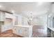 Stylish kitchen island with white cabinets and countertops at 2028 Cedar Falls Dr # 10, Waxhaw, NC 28173