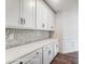 Bright kitchen with white cabinets, quartz countertops, and stylish mosaic tile backsplash at 2028 Cedar Falls Dr # 10, Waxhaw, NC 28173