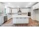 Large kitchen featuring a center island, stainless steel appliances, and white cabinetry at 2028 Cedar Falls Dr # 10, Waxhaw, NC 28173