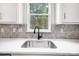 Modern kitchen sink features a view of nature from the window with natural light at 2028 Cedar Falls Dr # 10, Waxhaw, NC 28173