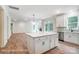 Open-concept kitchen and living area with stainless steel appliances and a large center island at 2028 Cedar Falls Dr # 10, Waxhaw, NC 28173