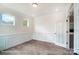 Bright living room featuring wainscoting and hardwood floors at 2028 Cedar Falls Dr # 10, Waxhaw, NC 28173