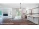 Bright, open-concept living and kitchen space with a fireplace and a sliding glass door at 2028 Cedar Falls Dr # 10, Waxhaw, NC 28173