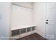 Practical mudroom with storage bench, hooks, and a door to the exterior at 2028 Cedar Falls Dr # 10, Waxhaw, NC 28173