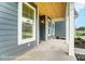 Inviting front porch with wood plank ceiling and views of the neighborhood at 2028 Cedar Falls Dr # 10, Waxhaw, NC 28173