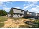 Spacious backyard with a patio and gray vinyl siding on the home at 2046 E Park Dr, Lancaster, SC 29720