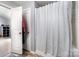 Bright bathroom featuring a shower with striped curtain and a neutral color palette at 2046 E Park Dr, Lancaster, SC 29720