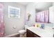 ' bathroom with unicorn-themed decor, a vanity, and a window at 2046 E Park Dr, Lancaster, SC 29720