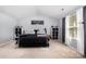 Bright bedroom features a large bed, neutral carpeting, and ample storage space at 2046 E Park Dr, Lancaster, SC 29720