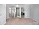 Open hallway with neutral carpeting and paint, offering access to multiple rooms at 2046 E Park Dr, Lancaster, SC 29720