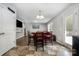 Eat-in kitchen with stainless steel appliances, dark wood cabinets, and a dining area at 2046 E Park Dr, Lancaster, SC 29720
