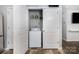 Laundry closet with a washer and dryer, shelving, and ample storage space at 2046 E Park Dr, Lancaster, SC 29720