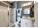 Modern bathroom with a glass-enclosed shower, a white vanity, and neutral decor at 3005 Oakmere Rd, Waxhaw, NC 28173