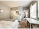 Inviting bedroom featuring neutral colors, a white dresser, a desk, and plenty of natural light at 3005 Oakmere Rd, Waxhaw, NC 28173
