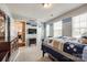 Bedroom with multiple windows, built-in tv and a connected room at 3005 Oakmere Rd, Waxhaw, NC 28173