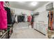 Spacious walk-in closet with shelving, hanging racks, drawers, and ample storage space at 3005 Oakmere Rd, Waxhaw, NC 28173