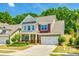 Charming two-story home featuring a well-manicured lawn, covered porch, and attached two-car garage at 3005 Oakmere Rd, Waxhaw, NC 28173