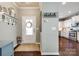 Welcoming foyer with hardwood floors, decorative accents, and a view into the kitchen at 3005 Oakmere Rd, Waxhaw, NC 28173