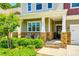 Inviting front porch with stone accents, decorative seating, and well-maintained landscaping at 3005 Oakmere Rd, Waxhaw, NC 28173