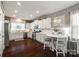 Modern kitchen featuring white cabinetry, stainless steel appliances, and hardwood floors at 3005 Oakmere Rd, Waxhaw, NC 28173