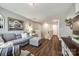 Comfortable living room featuring hardwood floors, gray furnishings, and plenty of natural light at 3005 Oakmere Rd, Waxhaw, NC 28173