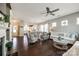 Spacious living room with hardwood floors, neutral furniture, and large windows with lots of natural light at 3005 Oakmere Rd, Waxhaw, NC 28173