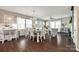 Open-concept living and dining area with hardwood floors and abundant natural light at 3005 Oakmere Rd, Waxhaw, NC 28173
