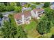 Aerial view of a property with a fenced yard, patio, and lush greenery in a quiet neighborhood at 3124 Arklow Rd, Charlotte, NC 28269