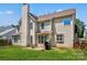 Exterior backyard view with a small patio, grill, and green grass at 3124 Arklow Rd, Charlotte, NC 28269