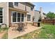 Inviting backyard featuring a patio with dining set and grill, perfect for outdoor entertaining at 3124 Arklow Rd, Charlotte, NC 28269
