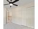 Bedroom with a ceiling fan, light beige walls, white trim, and closet at 3124 Arklow Rd, Charlotte, NC 28269