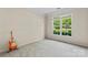 Bedroom features a large window providing ample natural light and neutral carpeting at 3124 Arklow Rd, Charlotte, NC 28269