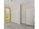 Neutral bedroom featuring carpet floors, double door closet and a bright window at 3124 Arklow Rd, Charlotte, NC 28269