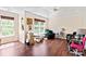 Bright bedroom featuring hardwood floors, a ceiling fan, and natural light at 3124 Arklow Rd, Charlotte, NC 28269