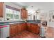 Kitchen with dark wood cabinets, stainless steel appliances, and an open layout at 3124 Arklow Rd, Charlotte, NC 28269