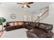 Inviting living room featuring a plush sectional sofa, ceiling fan, and a cozy atmosphere at 3124 Arklow Rd, Charlotte, NC 28269