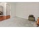 Neutral carpeted living room with modern archway entrance and white walls at 3124 Arklow Rd, Charlotte, NC 28269