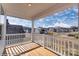 Balcony view overlooking the community with white railings and a wood floor under a covered ceiling at 3242 Bozeman Ct # 8, Stanley, NC 28164
