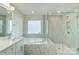 Bathroom showcases a soaking tub and glass-enclosed shower with stunning white marble tiling at 3242 Bozeman Ct # 8, Stanley, NC 28164
